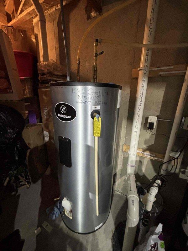 Replaced undersized lower heating element on 100-gallon Westinghouse electric water heater that had failed catastrophically due to extensive corrosion. The original element had deteriorated to the point of complete failure, causing insufficient hot water supply. Installed properly sized replacement heating element to restore normal hot water function under warranty service.