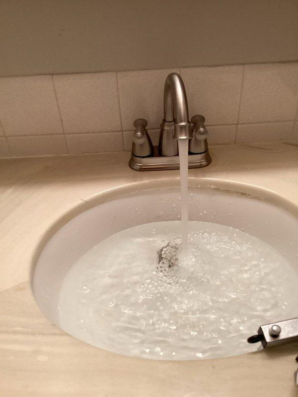 Successfully installed two new customer-furnished lavatory faucets with brushed nickel finish. Identified lower level hot side shut-off valve that is stuck and requires replacement. Will return to complete this additional repair once customer coordinates water shut-off to the unit, as main water valve is located in another unit.