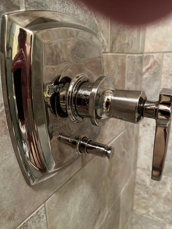 Diagnosed and replaced failed Kohler shower diverter mechanism that was stuck between tub and shower positions. Installed new cartridge to restore proper functionality and added customer-requested handheld showerhead to complete the service.