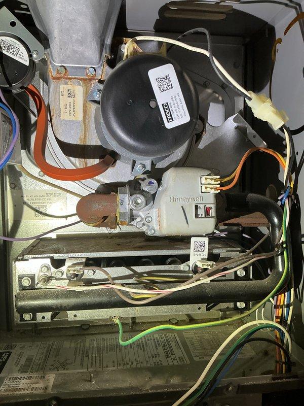 Performed comprehensive tune-up on 10-year-old furnace system. Inspected interior components including Honeywell control module and electrical connections, noting some normal wear and minor corrosion. Conducted thorough inspection of ductwork using DEPSTECH camera, confirming presence of significant dust accumulation requiring professional cleaning service.