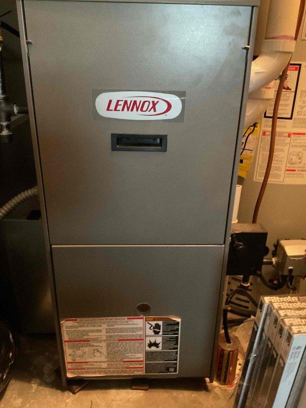 Performed AC tune-up on Lennox system and discovered two significant issues: refrigerant leak with low R22 levels and a cracked heat exchanger with missing igniter. Recommended full system replacement due to age of equipment and safety concerns with the compromised heat exchanger.