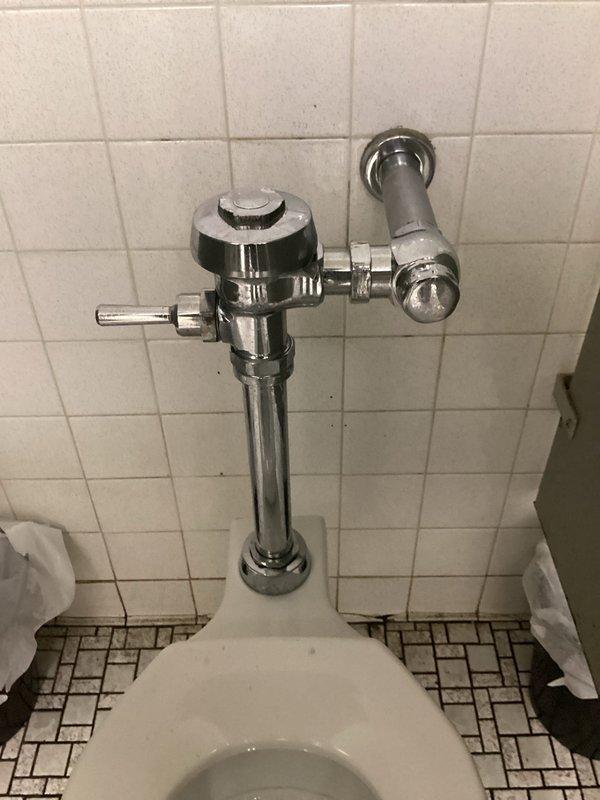 Responded to service call regarding a leaking pipe above toilet in women's restroom. Upon inspection, identified a malfunctioning flushometer with damaged diaphragm. Replaced the flushometer diaphragm to resolve the leak and restored proper toilet function.