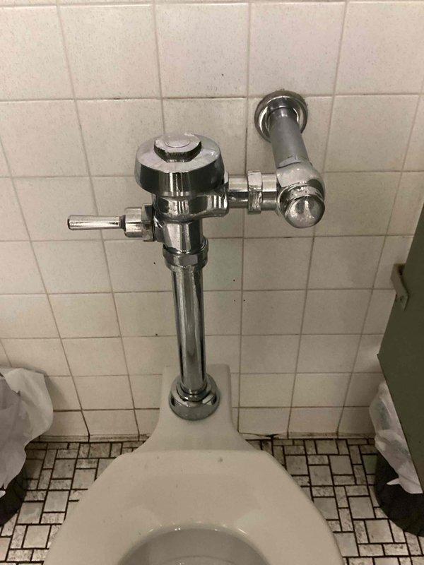Responded to service call regarding a leaking pipe above toilet in women's restroom. Upon inspection, identified a malfunctioning flushometer with damaged diaphragm. Replaced the flushometer diaphragm to resolve the leak and restored proper toilet function.