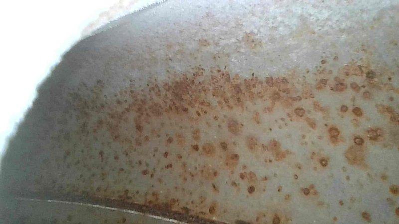 Performed comprehensive furnace tune-up on 9-year-old FRP system, including gas pressure verification, temperature rise assessment, and burner cleaning. System components checked and confirmed to be operating correctly with good airflow parameters. Replaced air filter and left spare filter on site. Noted rust formation on interior metal surface requiring future monitoring.