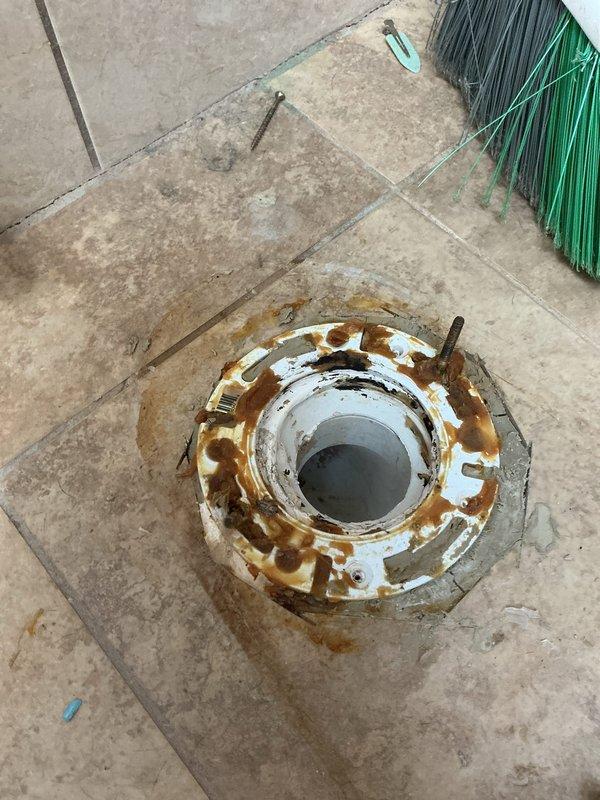 Inspected kitchen ceiling showing active water damage with visible staining and bubbling. Determined source was upstairs bathroom toilet with severely corroded flange and failing wax ring causing phantom leak. No active plumbing line breach found. Referred customer to water damage restoration company for ceiling repair.