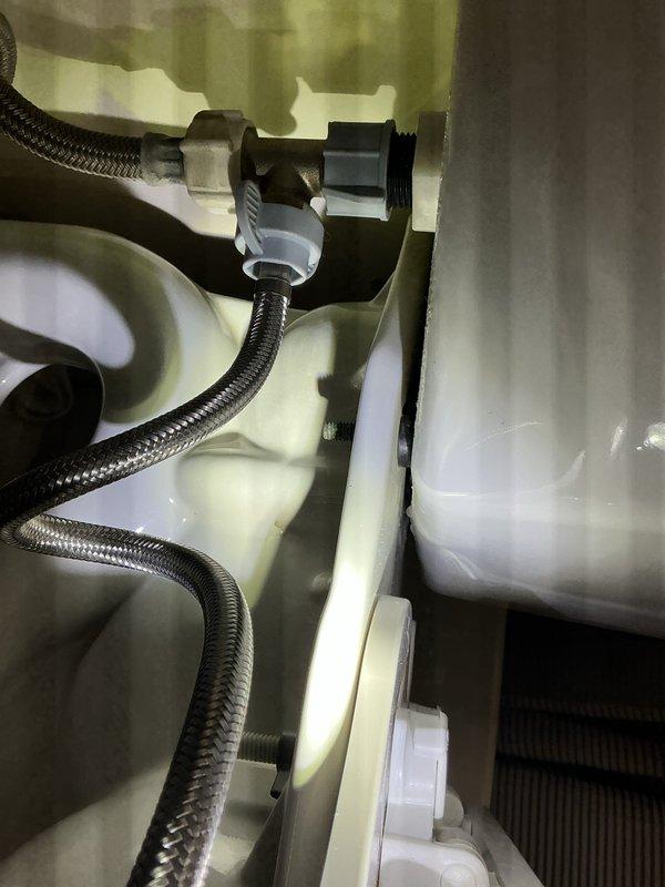 Diagnosed and repaired a water leak from bathroom sink that was causing water to accumulate on the floor. Inspection revealed faulty supply line connections to the bidet attachment. Replaced worn braided stainless steel supply lines and properly secured all plumbing connections to resolve the leak issue.