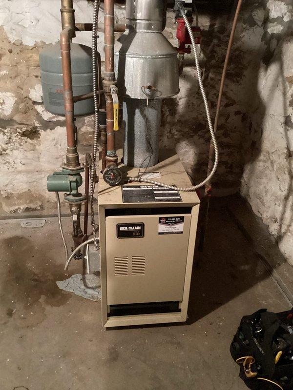 Performed comprehensive tune-up on 16-year-old Weil-McLain FRP boiler system including cleaning, system checks, and bleeding radiators on multiple levels. Identified non-functioning backflow preventer and auto-feed valve; temporarily added water via hose connection to maintain system operation. Verified proper heating function throughout residence and provided estimate for replacement of defective components.