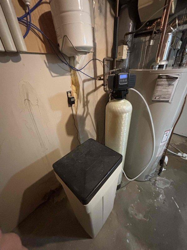 Diagnosed tank-type water heater failure with leakage onto the burner assembly, causing repeated shutoff after restart attempts. Visual inspection confirmed water damage to heating components. Complete unit replacement was performed to restore hot water service.