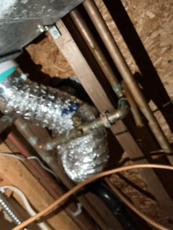 Inspected shower valve and identified defective cartridge causing handle issues. Provided customer with repair options including valve replacement and new water heater installation. Customer elected to attempt cartridge replacement independently. Also evaluated existing water heater system and exterior spigots, noting proper pipe connections but signs of aging on copper lines.