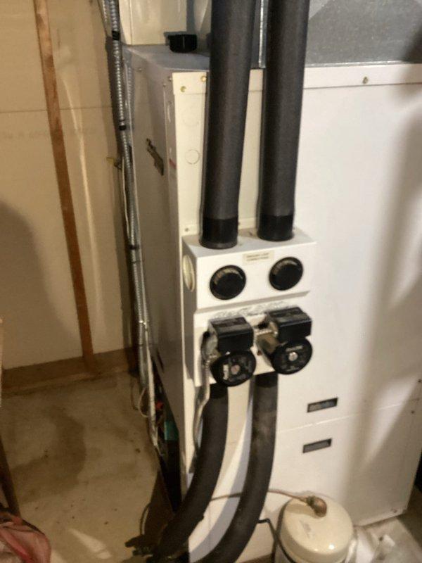 Diagnosed and repaired geothermal unit experiencing operational failure due to non-functioning pumps. Found defective control board with damaged fuse holder, installed breaker switch as solution, replenished loop water, and verified system operation. Secondary inspection of gas furnace confirmed both heating systems functioning properly, though noted floor heat water heater requires separate service.