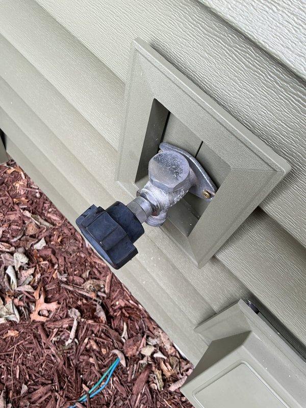Completed exterior hose bib reinstallation following customer's home residing project. Two outdoor water spigots were properly secured and mounted to the vinyl siding using the appropriate recessed mounting boxes, ensuring proper alignment and secure attachment with mounting screws.