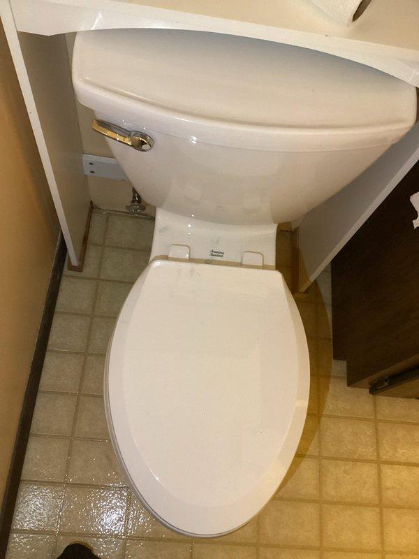 Responded to service call regarding shut-off valve leakage at toilet. Upon inspection, determined leaking was occurring at the packing nut of the shut-off valve. Replaced the faulty shut-off valve to resolve the issue.