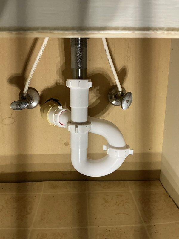 Responded to a service call for multiple bathroom plumbing issues. Diagnosed and cleared a plugged toilet using an auger, extracted significant hair buildup from the bathroom sink drain which was causing slow drainage and odor, and tightened the pop-up assembly mechanism to restore proper functionality. Inspected bathtub drain but found no obstructions.