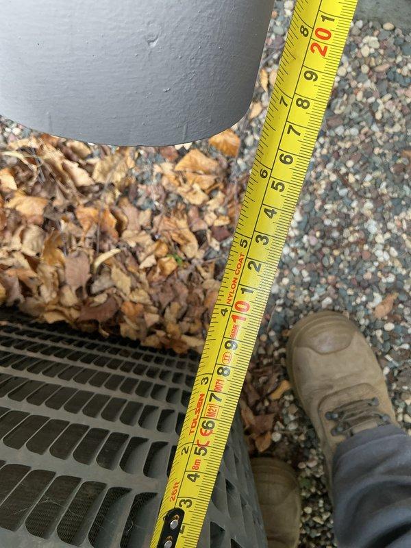 Diagnosed leaking 75-gallon power-vent water heater with no hot water output. Took measurements of clearance requirements for replacement unit and documented existing installation conditions. Recommended replacement water heater with expansion tank and coordination with HVAC technician regarding condenser relocation.