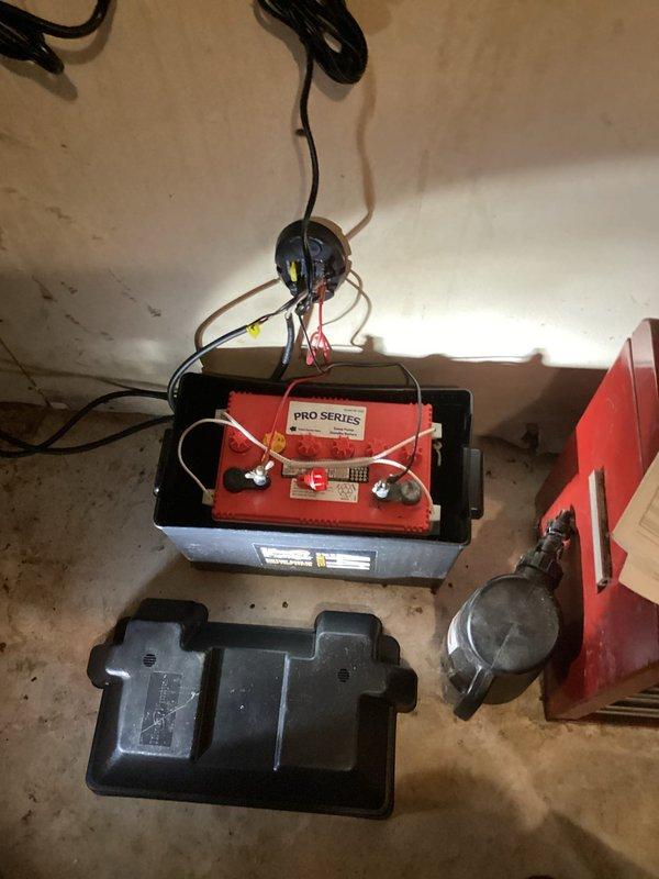 Successfully installed and connected a PRO SERIES battery for customer's battery backup sump pump system in basement utility area, ensuring proper terminal connections and secure mounting within the designated housing unit. System was tested and verified operational to provide emergency power during outages.