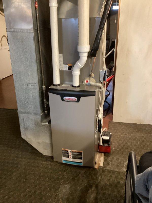 Responded to customer complaint of AC leaking fluid. Inspection revealed significant debris accumulation in the evaporator drain pan causing overflow past the drain line. Removed evaporator cover, thoroughly cleaned debris from pan, and flushed drain line to restore proper drainage. System was tested under operation for an extended period to confirm successful resolution of the leak issue.