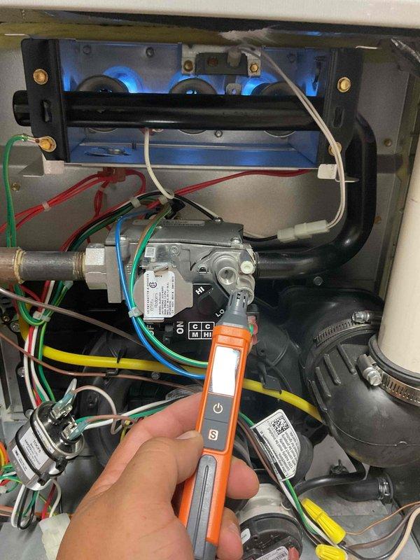 Performed fall furnace tune-up maintenance service on operational unit. Conducted electrical diagnostic testing of components using multimeter, and verified proper operation of gas valve assembly and combustion chamber with healthy blue flame pattern. System functioning normally with no issues identified.