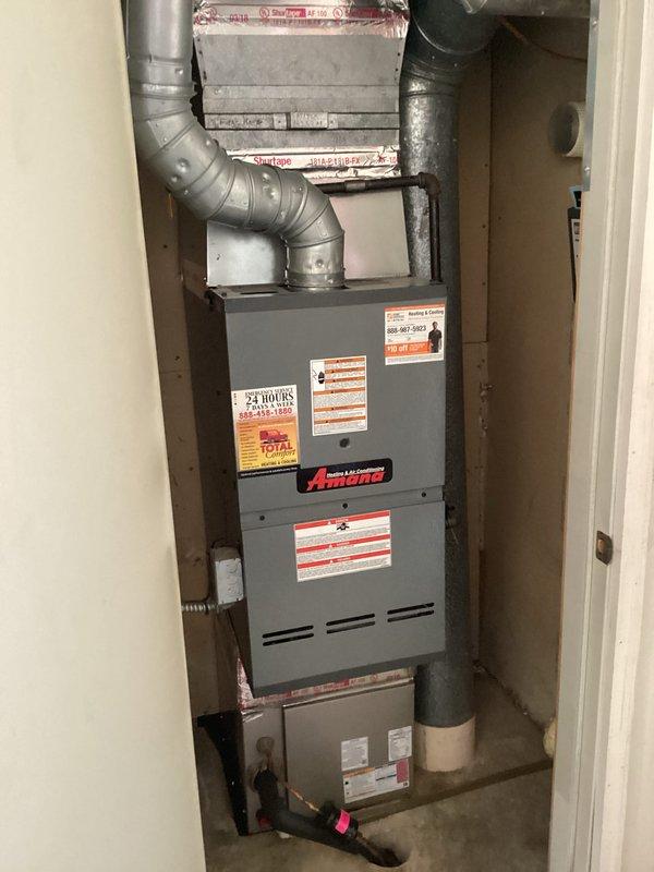 Performed comprehensive inspection on 10-15 year old tanked water heater located in compact utility closet. System includes copper plumbing network with circulation pump and multiple valve connections. Provided client with maintenance recommendations and replacement estimates due to unit's advanced age, though no immediate operational issues were identified.