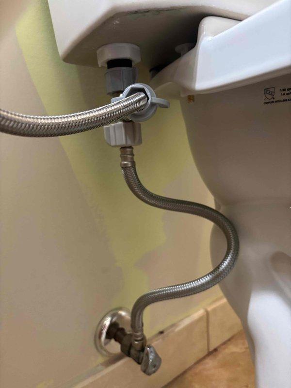 Completed installation of new ADA-compliant toilet with elongated bowl to replace customer's existing unit which had multiple failures including leaking tank-to-bowl gasket and worn fill valve causing continuous running. Installed complete toilet package with wax ring and mounting bolts, connected water supply lines, and ensured proper function of new fixture which provides improved performance while using less water.