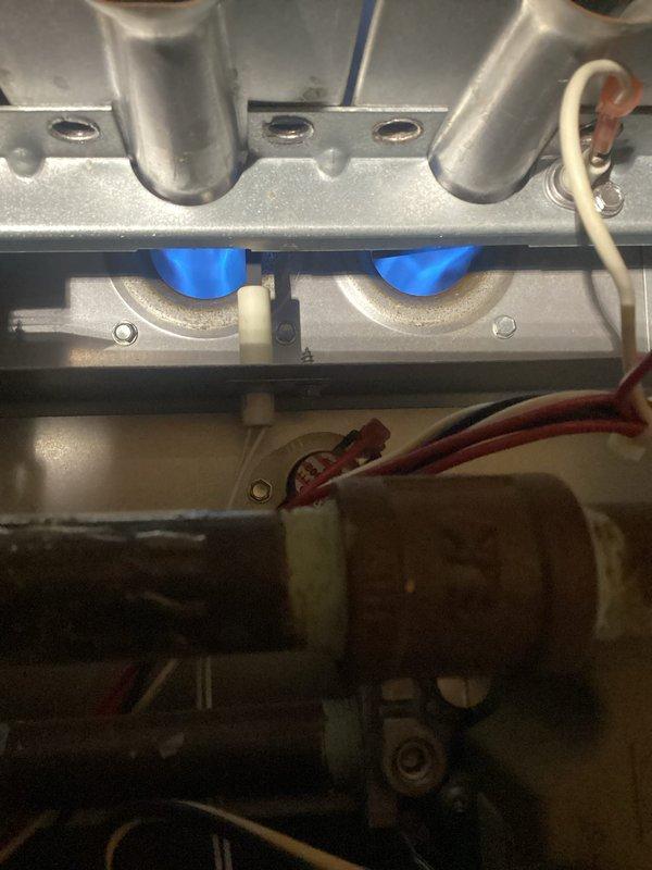 Completed furnace tune-up on 17-year-old FRP unit. Replaced customer-supplied filter, verified clean blower within specifications, and checked electrical components. Noted inducer motor drawing excessive amperage (4A vs. 0.24A specification) and observed concerning areas on heat exchanger, though no visible cracks were found. System initially cycled off without error codes but performed normally during extended testing with proper 45° temperature rise. Customer informed about inducer performance concerns, heat exchanger condition, and benefits of maintenance agreement.