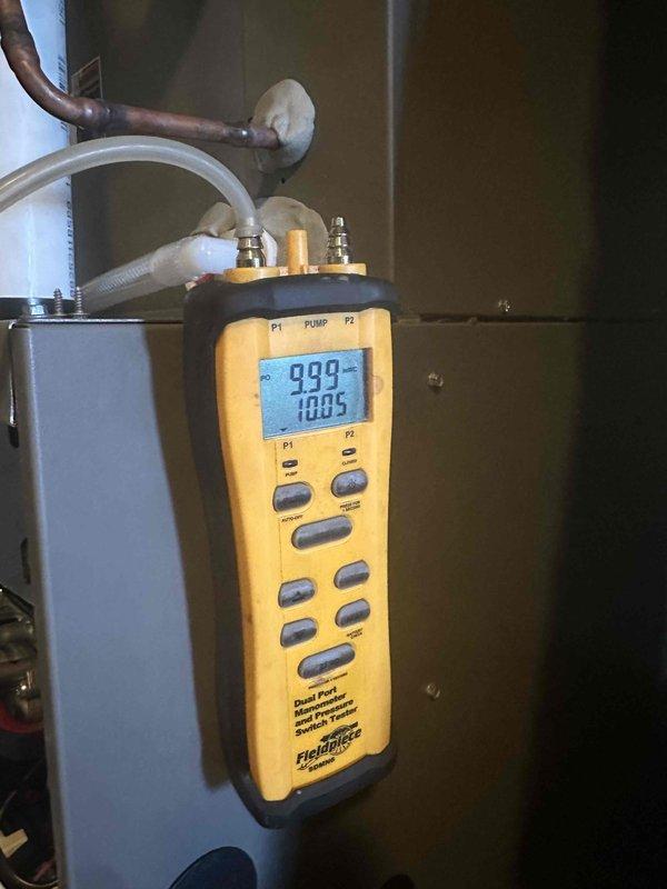 Completed gas pressure validation and adjustment following LP regulator replacement by gas company. Verified proper operation of newly installed secondary regulator and confirmed appropriate gas pressure settings for both high and low fire operation using dual port manometer.