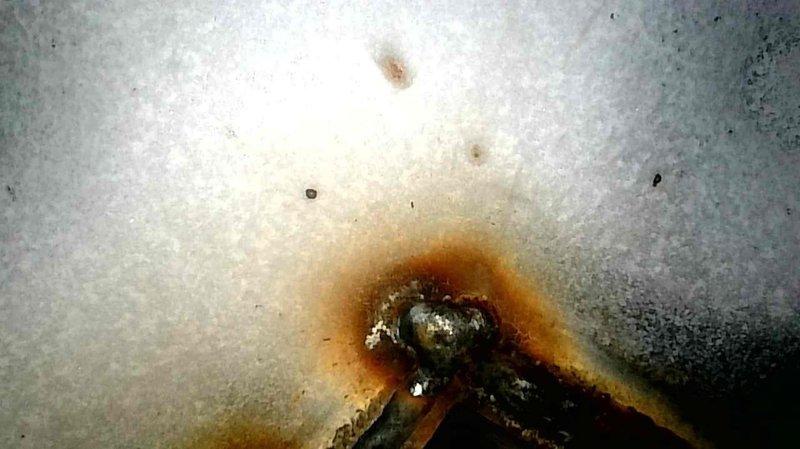 Responded to callback service request for thermostat displaying error code 53. Inspected and secured all wiring connections at thermostat and control board, verified proper voltage readings throughout system. Performed comprehensive diagnostic testing including heat exchanger inspection, which revealed rust buildup on one heat exchanger eyelid. Carbon monoxide levels and gas pressure (both low and high) tested within acceptable safety parameters. Informed homeowner about heat exchanger condition and explained that thermostat lacks reset functionality for the specific error code.