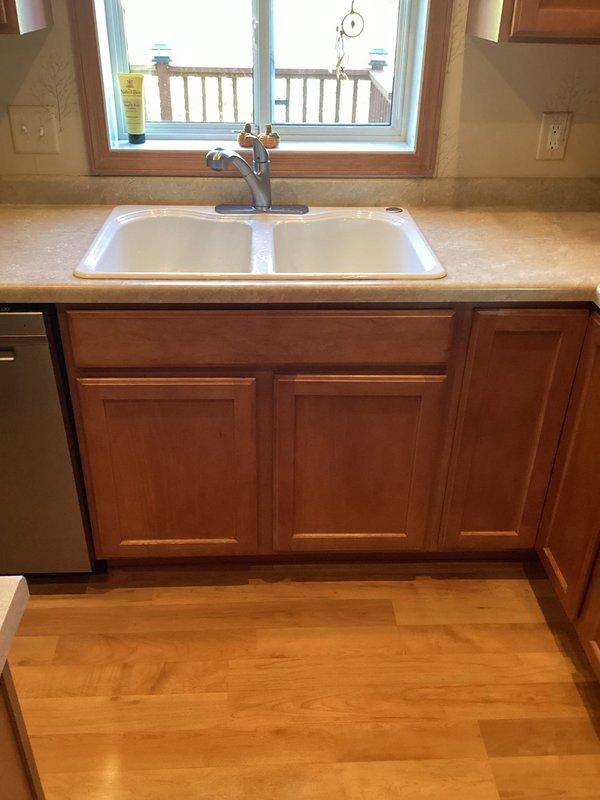 Responded to a service call regarding water leak between garbage disposal and kitchen drain pipe. Diagnostic inspection revealed significant leakage during disposal operation and a clogged kitchen drain. Deployed drain snake equipment to clear blockage and repaired the connection between disposal unit and drain pipe, eliminating leak. Verified proper function with water test.