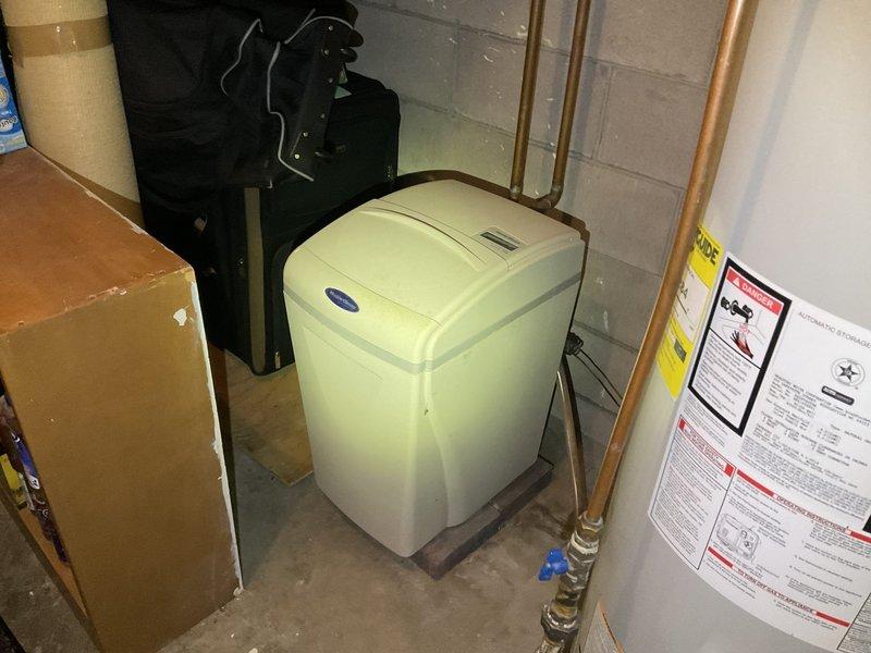 Conducted evaluation of non-functional WaterBoss water softener that was leaking and operating at reduced capacity. Documented existing installation in basement utility area with photos. Provided customer with replacement options including new water softener system and carbon filter.