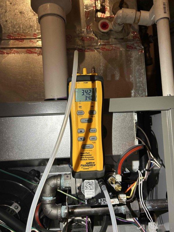 Performed comprehensive furnace tune-up service addressing several maintenance issues. Cleaned dirty flame sensor, cleared beehive buildup from fresh air intake/exhaust, replaced dirty filter, and addressed condensation leak at bottom right of furnace. Additionally, adjusted gas pressure on low/high settings, cleared condensation drain line, and verified normal carbon monoxide levels using diagnostic equipment.