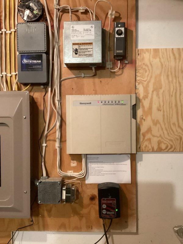 Performed diagnostic assessment of York HVAC system with heat pump, multi-zone configuration, and whole home filtration after customer reported inadequate heating performance. Located wide-open intake vent damper on unused makeup air system allowing cold air infiltration; manually closed to improve system efficiency. Identified non-functional air exchanger with failed fan motor and damper (parts obsolete); scheduled advisor visit for replacement quote. Heat pump and zoning systems operating correctly; gas furnace test confirmed proper function.