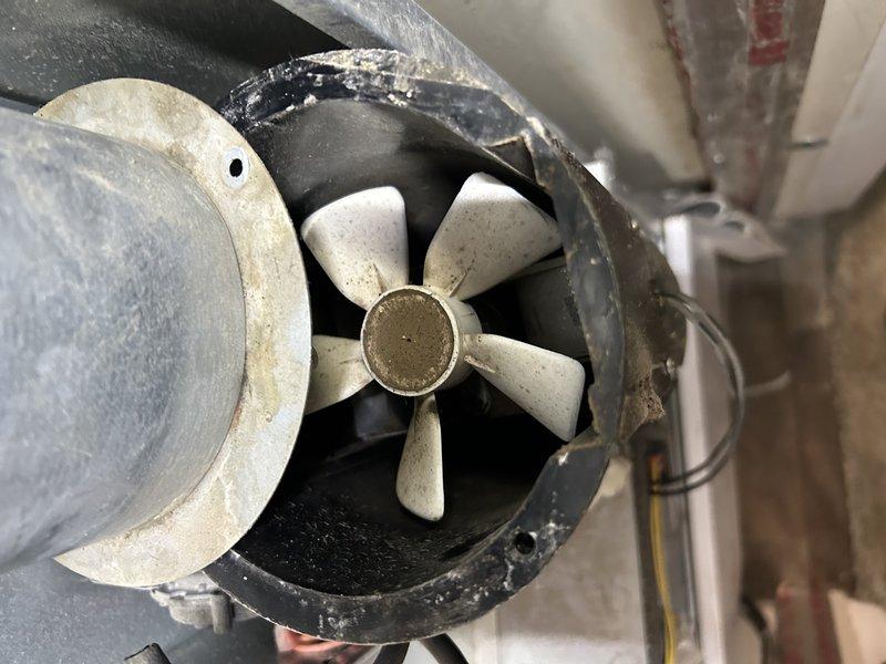Diagnosed customer's "no heat" complaint on 10-15 year old furnace. Discovered seized inducer motor causing system to hum without producing heat. Removed inducer assembly to inspect for blockages, confirmed bearing failure was the root cause. Customer approved replacement of inducer motor to restore proper heating function.