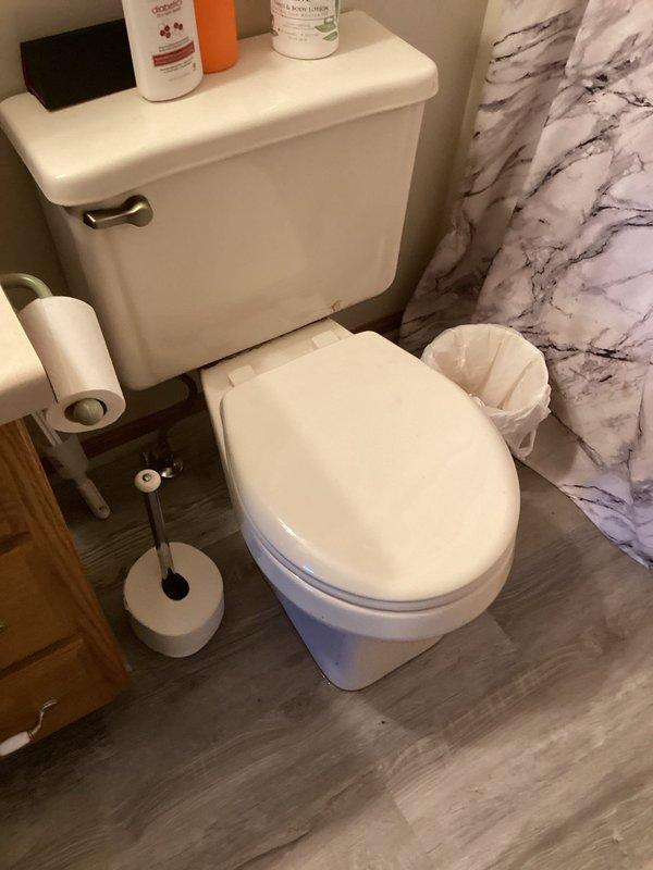 Successfully installed two toilets in the customer's residence as specified in the sold repair order: one standard height round bowl white toilet and one comfort height toilet. Both installations were completed efficiently with proper placement in separate bathrooms, ensuring proper function and sealing.