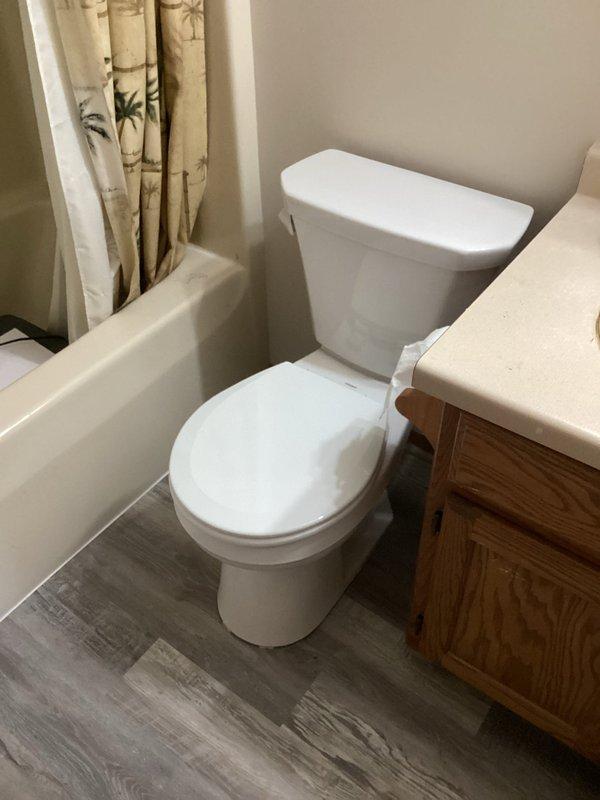 Successfully installed two toilets in the customer's residence as specified in the sold repair order: one standard height round bowl white toilet and one comfort height toilet. Both installations were completed efficiently with proper placement in separate bathrooms, ensuring proper function and sealing.