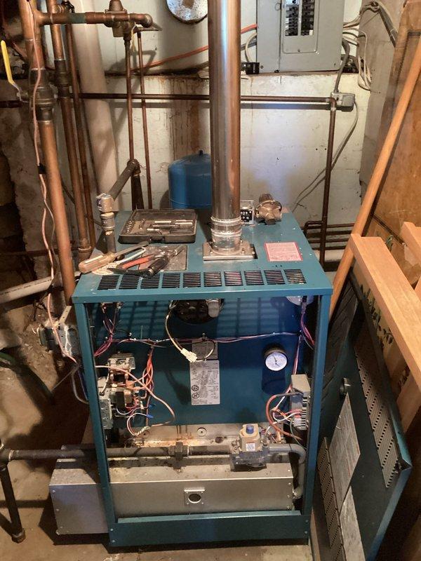 Diagnosed excessive noise from commercial boiler blower assembly. Disassembled unit to inspect blower wheel which showed no debris accumulation; determined bearing and motor failure as root cause. Performed temporary noise reduction measures and requested pricing/availability for replacement combustion blower from Parts department.