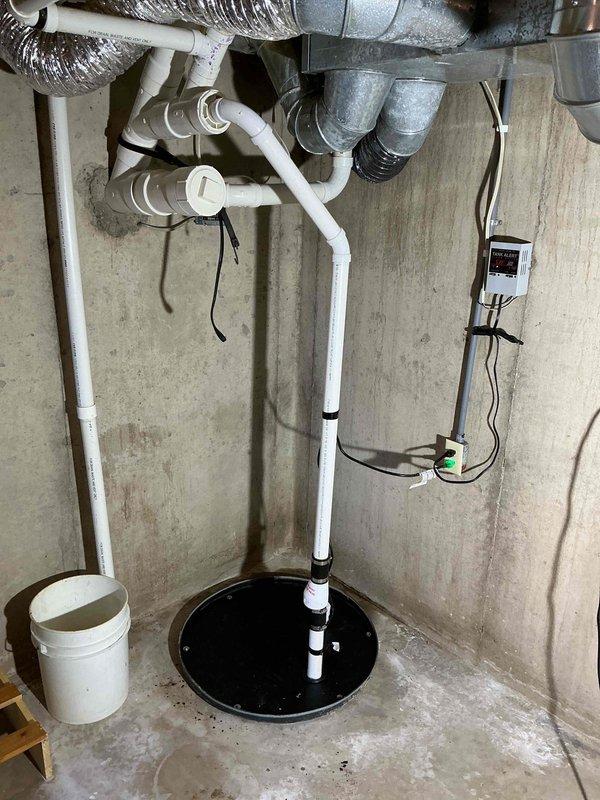 Replaced damaged sump pump lid on existing system in basement utility area. Although the existing pump was operational but aging, customer declined full pump replacement after price discussion. Completed installation of new lid to ensure proper sump system functionality and safety.