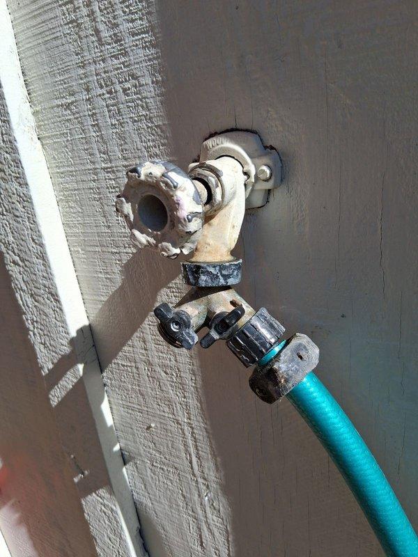 Replaced deteriorated Woodford frost-proof outdoor faucet that was actively leaking and failing to shut off water flow. Installed new frost-proof hose bib to restore proper functionality and eliminate leakage.