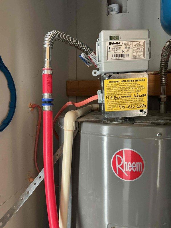 Diagnosed 5-year-old Rheem electric water heater with complete failure due to tank rupture. Recommended full replacement of unit as repair not feasible. Also noted customer request to replace whole home water filter (CF-155358-43); discussed replacement options but deferred installation pending customer financing approval.