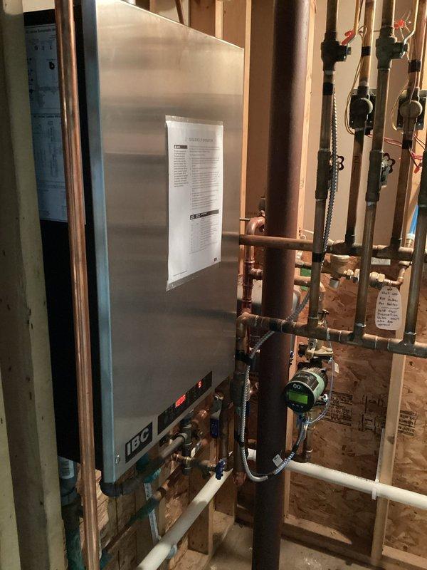 Completed comprehensive tune-up on IBC stainless steel boiler, including cleaning heat exchanger and verifying proper zone operation. Inspected all plumbing components, valves, and gauges throughout the mechanical room system. No issues identified; all systems functioning properly and ready for service.