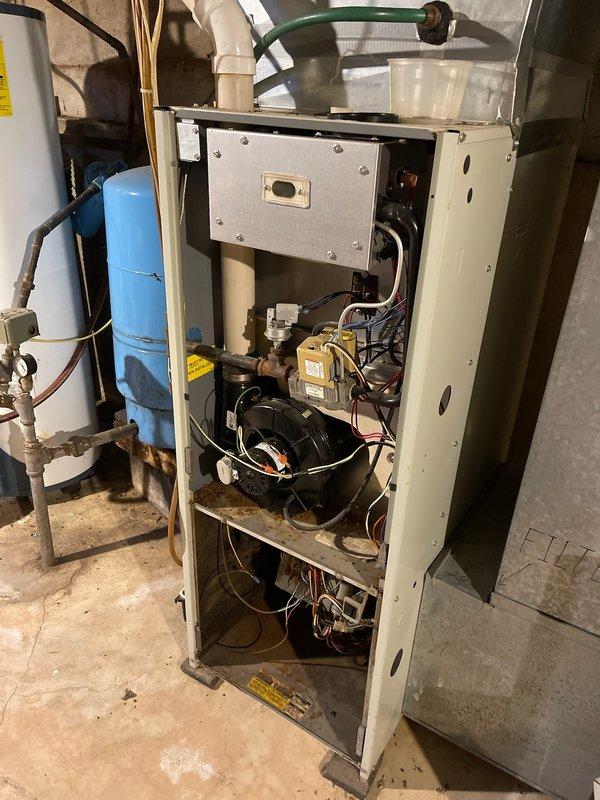 Responded to no heat call for LP-fueled furnace. Diagnosed multiple system failures including stuck gas valve preventing fuel flow to burners and out-of-specification capacitors for both blower motor and inducer. Scheduled follow-up appointment with advisor to address additional concerns with inducer and blower motor showing damage from capacitor issues.