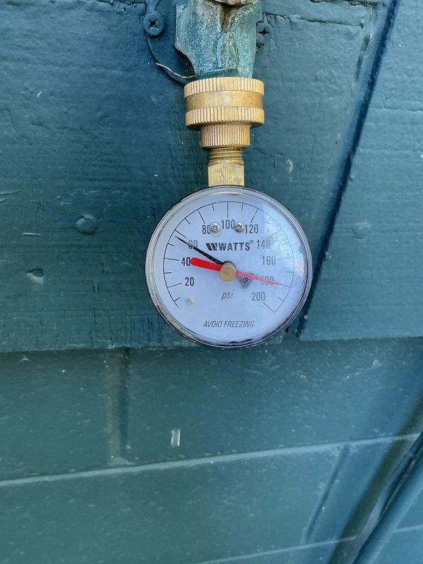 Completed residential service call to address lack of sump pump and code violations. Installed new sump pump system with battery backup to provide flood protection. Also addressed non-compliant water heater issues, bringing it up to current code requirements, and inspected faulty water softener with pressure gauge reading approximately 80 psi.