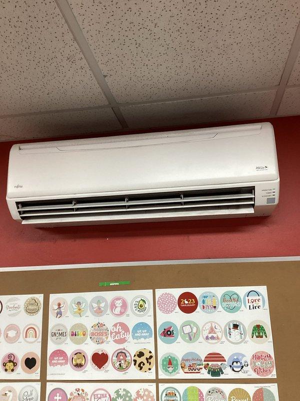 Performed comprehensive mini split deep cleaning service on a wall-mounted Fujitsu unit in commercial printing environment. System exhibited significant contamination due to industrial setting, requiring thorough cleaning of the head unit to restore proper operation. Recommended more frequent maintenance schedule given the high particulate environment.