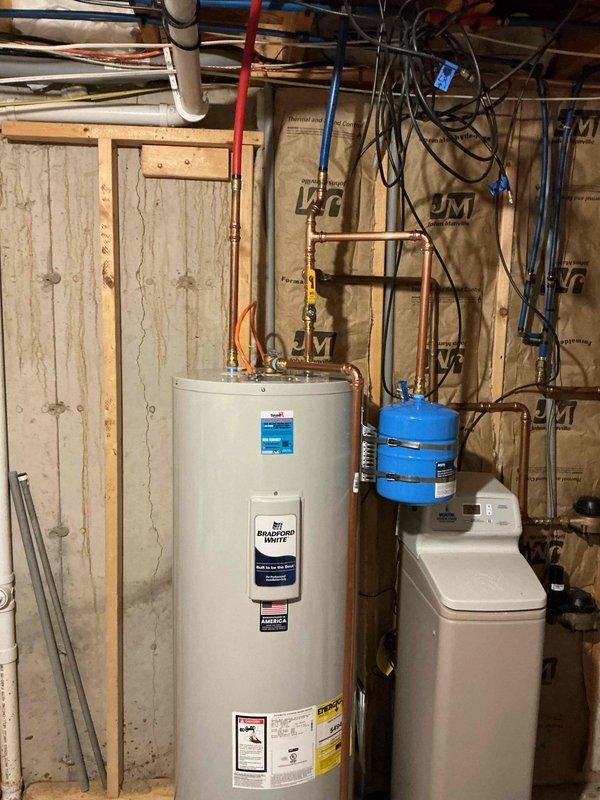 Replaced leaking 50-gallon electric water heater with new unit. Completed installation with existing plumbing configuration, connecting to copper supply lines, PEX tubing, and existing expansion tank. System was successfully installed alongside customer's water softener system in utility area.