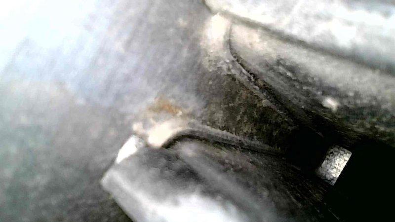 Upon inspection of the customer's furnace that was producing a grinding noise when temperature was adjusted via Nest app, I diagnosed the issue as a failing ECM inducer motor. While the noise was intermittent during my visit, I was able to confirm the source when powering down the system. I thoroughly inspected the heat exchanger and found no significant issues with the secondary exchanger, though noted minor surface rust that was confirmed to be superficial. Provided customer with replacement options for the ECM inducer and arranged for service advisor to discuss complete system replacement given the unit's age.