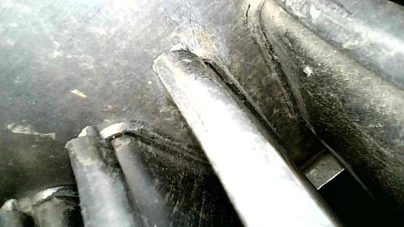 Upon inspection of the customer's furnace that was producing a grinding noise when temperature was adjusted via Nest app, I diagnosed the issue as a failing ECM inducer motor. While the noise was intermittent during my visit, I was able to confirm the source when powering down the system. I thoroughly inspected the heat exchanger and found no significant issues with the secondary exchanger, though noted minor surface rust that was confirmed to be superficial. Provided customer with replacement options for the ECM inducer and arranged for service advisor to discuss complete system replacement given the unit's age.