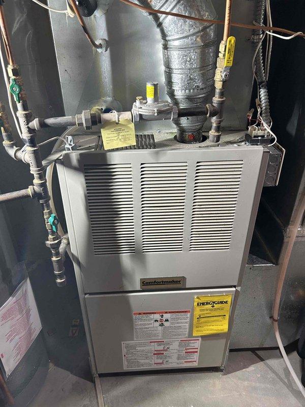 Performed furnace tune-up on 1999 Comfortmaker gas furnace. Inspection revealed crack in heat exchanger "eyelid" and dangerous CO levels rising from 14 ppm to 41 ppm within 5 minutes of operation. Advised homeowner of safety hazard and recommended replacement; homeowner indicated they would address through Minnesota Home Insurance.