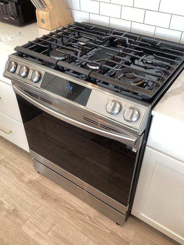 Successfully resolved gas leak at range connection by replacing the faulty connector. Pressure tested the entire system with diagnostic equipment to verify proper operation and ensure no further leaks were present. System now operating normally with safe gas pressure readings.