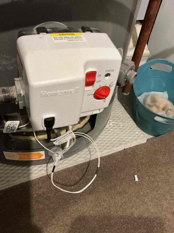 Returned to complete service on water heater - replaced flammable vapor sensor wire per previous diagnosis. Installed Honeywell control unit and verified proper operation of the system.