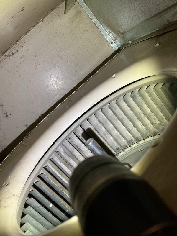Performed maintenance tune-up on 26-year-old high-efficiency Amana furnace. Inspection revealed critical failure of heat exchanger, with visible cracking on the transfer box where exchanger tube connects. Additionally identified serious deterioration of water heater exhaust pipe with pitted holes evident from condensation accumulation. System was immediately shut down for safety, and customer was provided repair options. Scheduled comfort advisor for follow-up consultation.