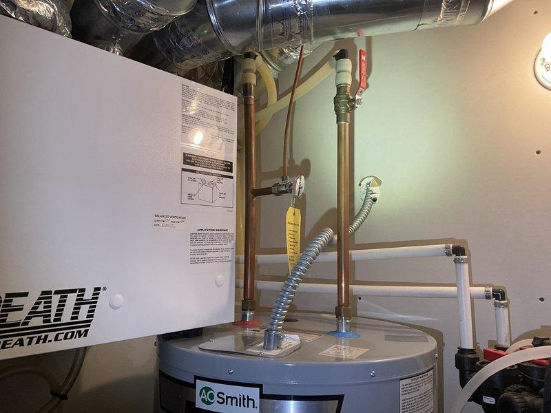 Replaced leaking 2017 A.O. Smith electric water heater that showed significant tank corrosion and floor staining at base. Customer accepted replacement estimate after inspection confirmed tank failure. Also inspected toilet with intermittent leak history, which had previously resolved itself.