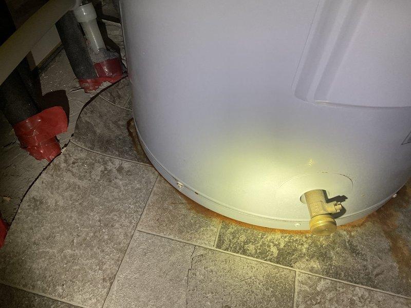 Replaced leaking 2017 A.O. Smith electric water heater that showed significant tank corrosion and floor staining at base. Customer accepted replacement estimate after inspection confirmed tank failure. Also inspected toilet with intermittent leak history, which had previously resolved itself.